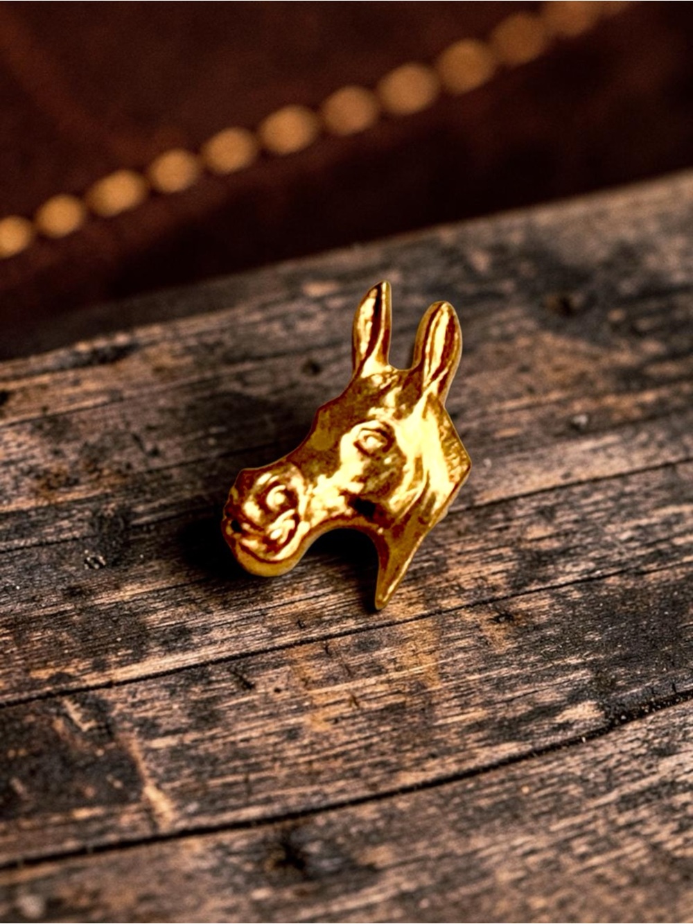 Vintage gold-tone figural donkey head pin presented on its original card
